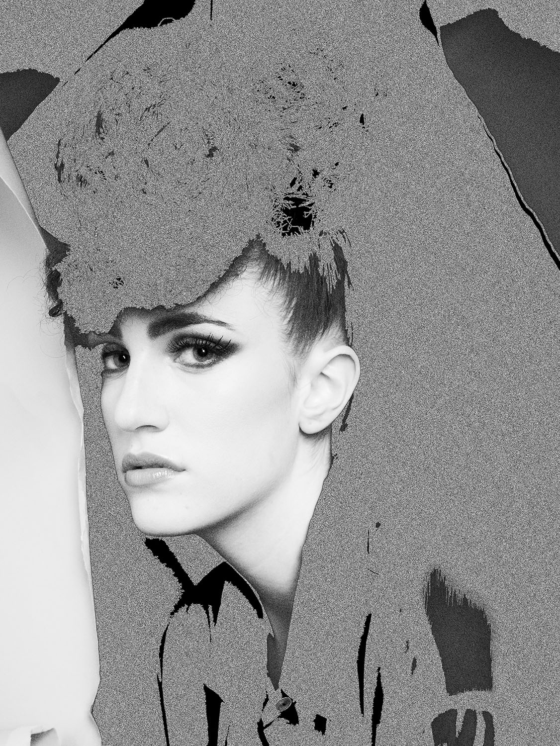 Avant-garde black and white beauty portrait of Renee Vermeuel with bold makeup and an abstract textured overlay, combining fashion and fine ar