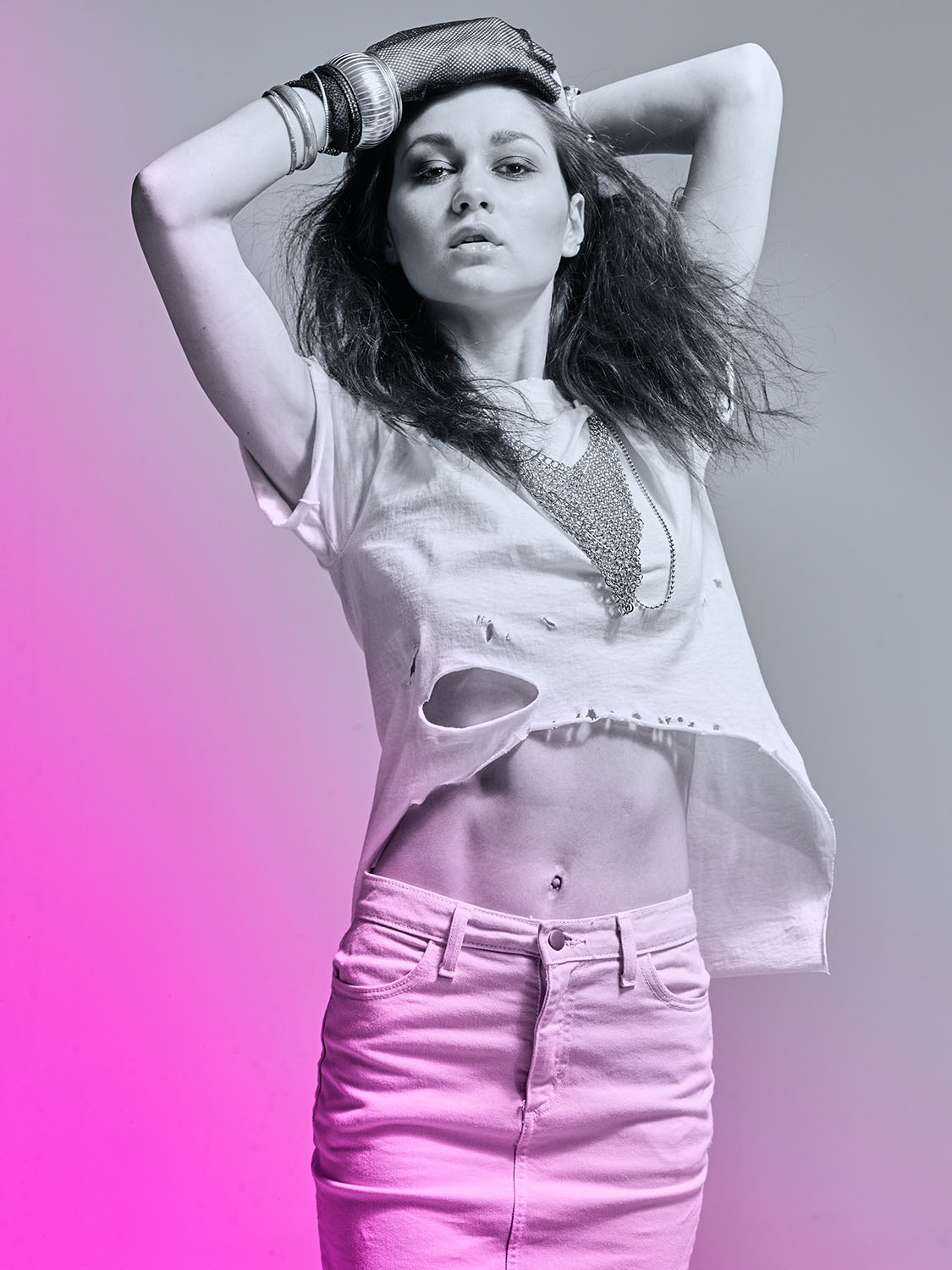 Fashion model in a studio photoshoot with 1980s-inspired editorial styling